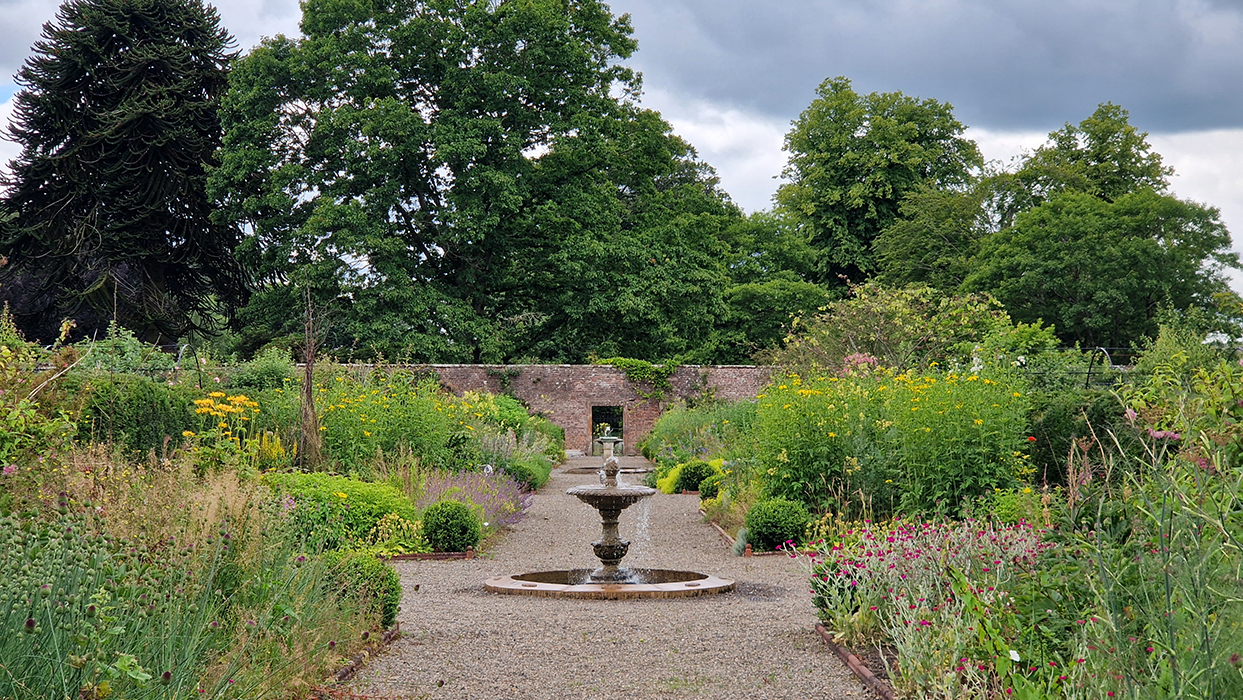 Netherby Hall walled garden, a long walk with central pools and fountains